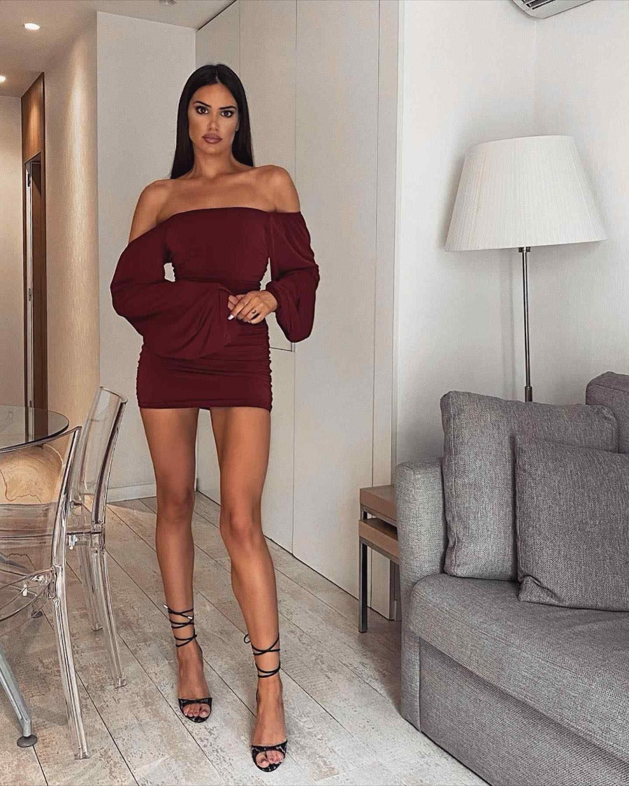 Mini dress with exaggerated sleeves and off-shoulder detail in burgundy red color