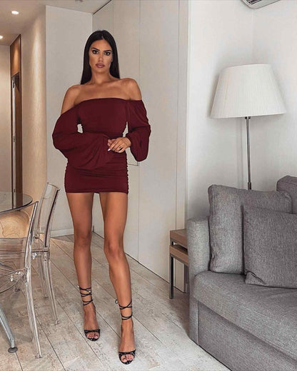 Mini dress with exaggerated sleeves and off-shoulder detail in burgundy red color